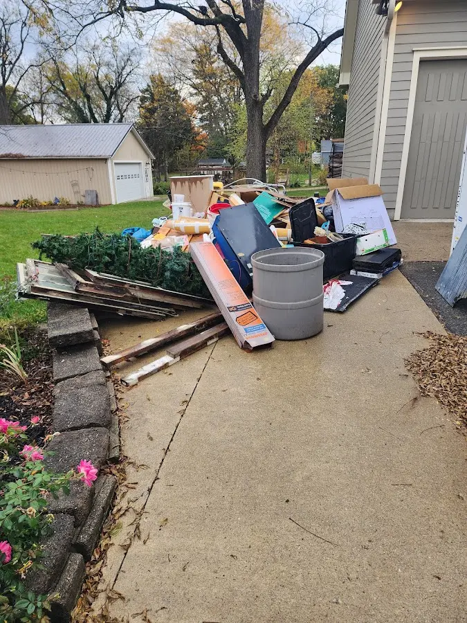 Dumpster being loaded with debris for Estate Cleanout Dumpster Rental in Lower Gwynedd